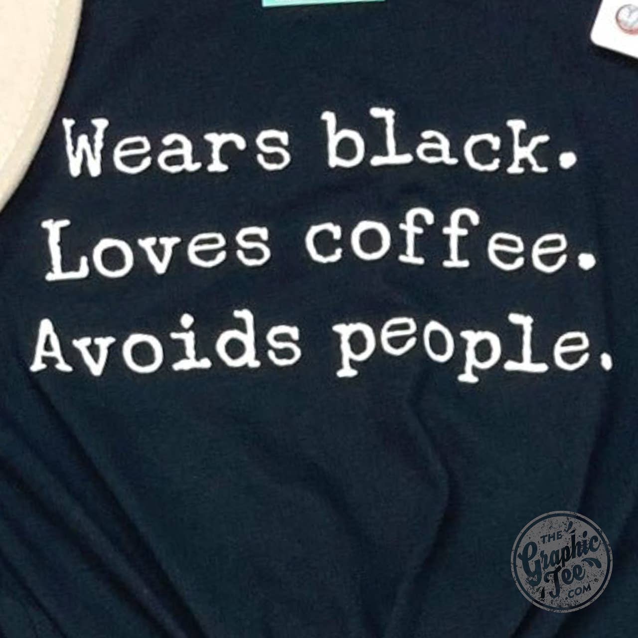 Wears black. Loves coffee. Avoids People. Black Short Sleeve Tee